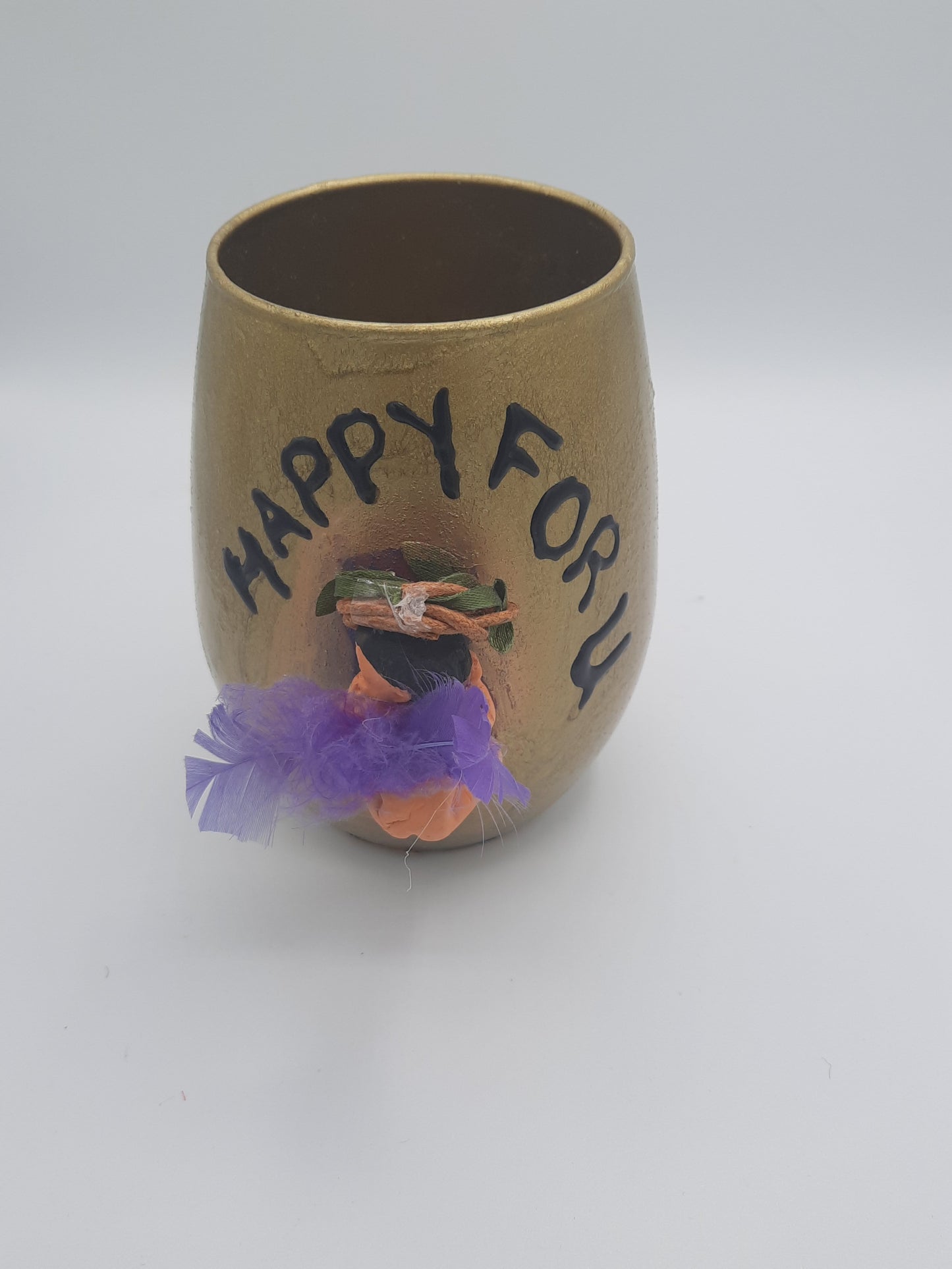 Baby miniature on a glass souvenier for mom to be wrapped as a gift