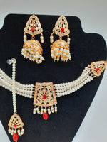 24k gold-plated imitation gold choker set with jhumka earrings and teeka in red and white combination of pearls