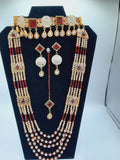 Bridal Jewelry in Golden base with maroon precious stones