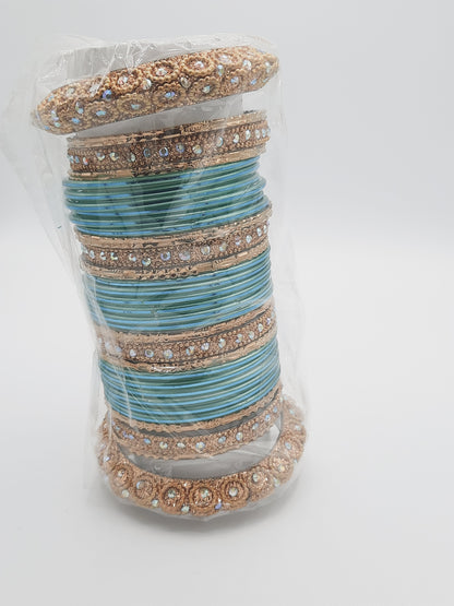 Bangles size 2.50 dia in shade of shiny aqua marine blue decorated with golden embellished kadas - NATASHAHS