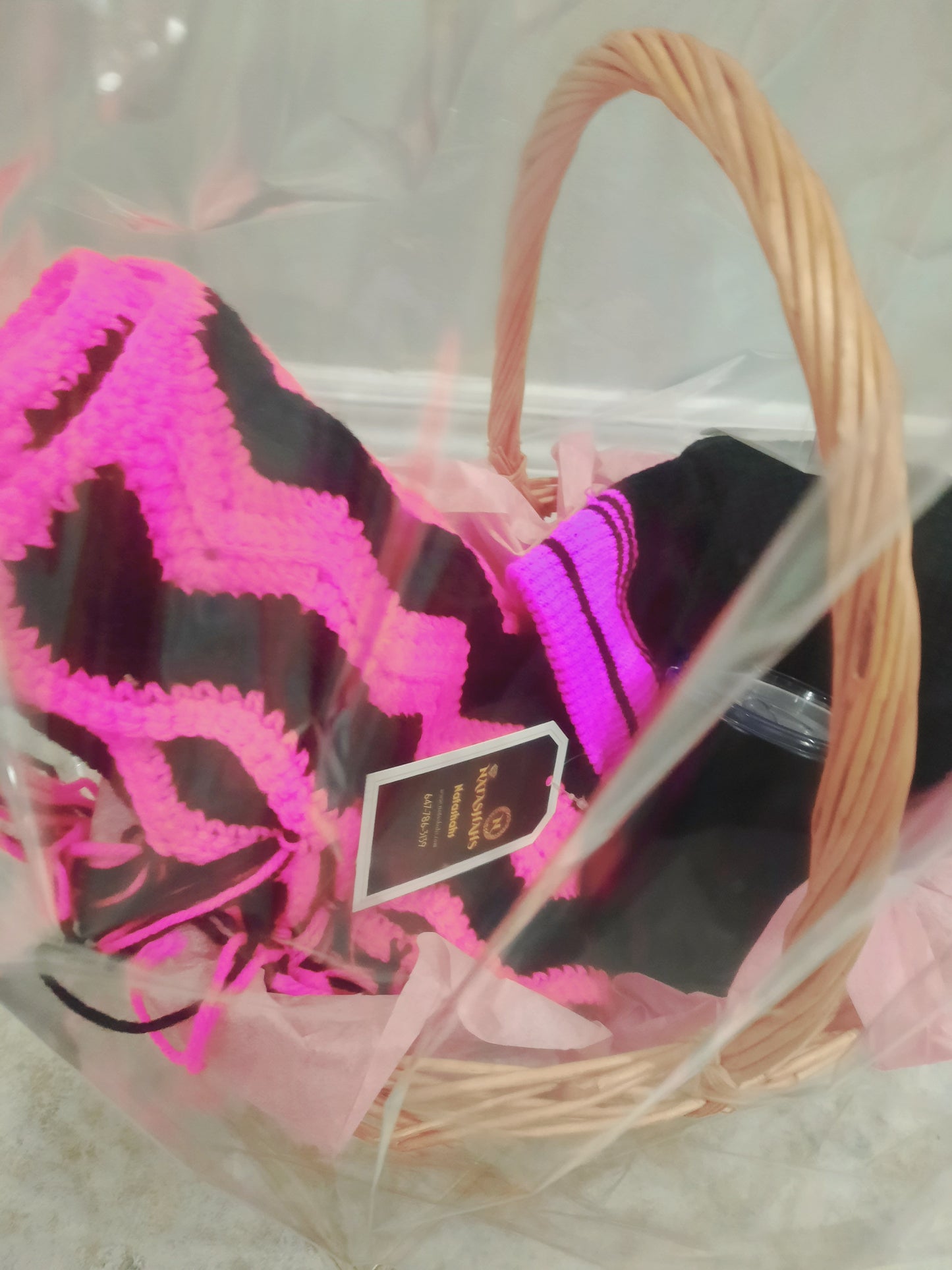 Accessories gift basket with winter scarf cap and tea mug