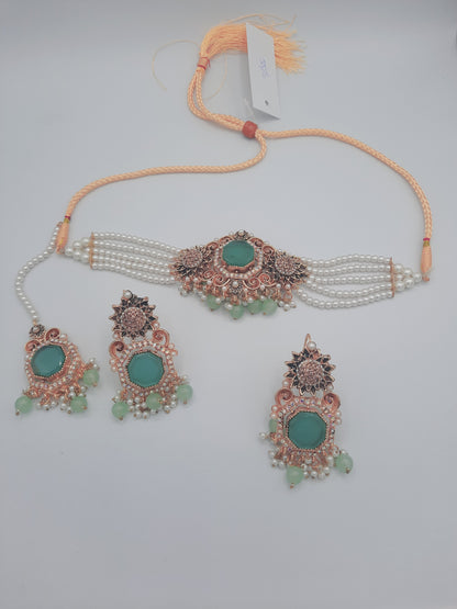 Anarkali Zircon choker set with guluband earrings and teeka in green color - NATASHAHS