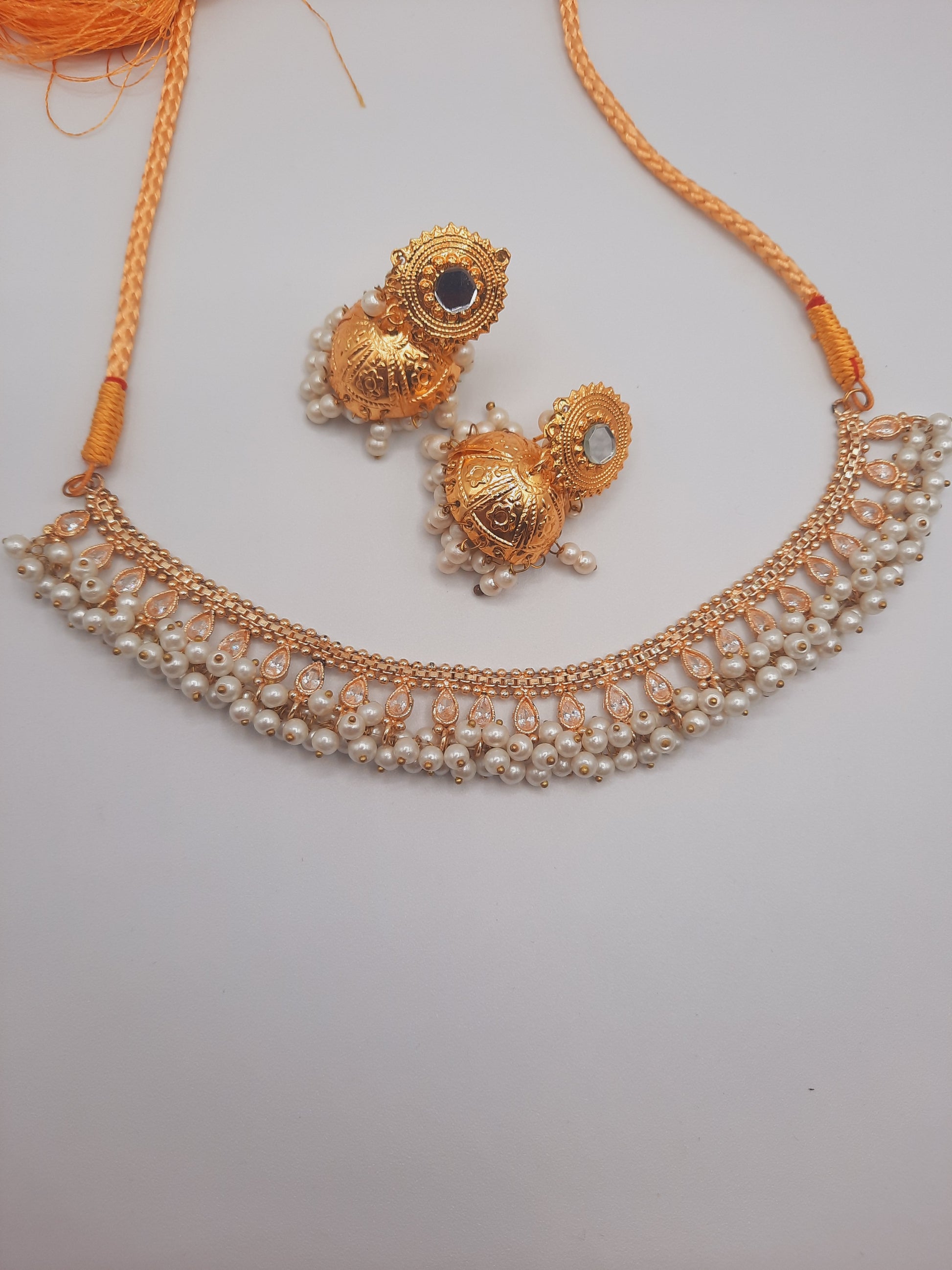 Gold-plated imitation jhumkas with white pearls and white pearls and kundan work necklace - NATASHAHS