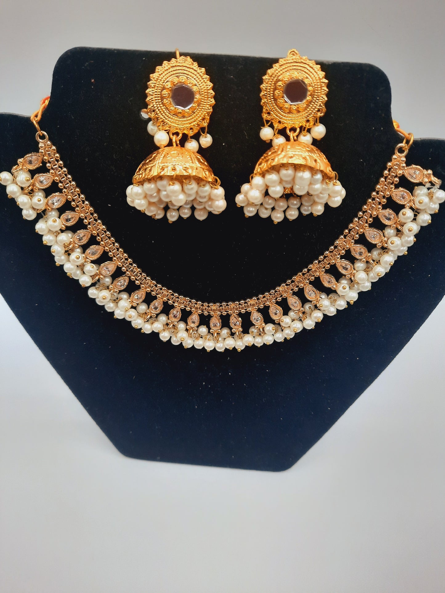Gold-plated imitation jhumkas with white pearls and white pearls and kundan work necklace - NATASHAHS