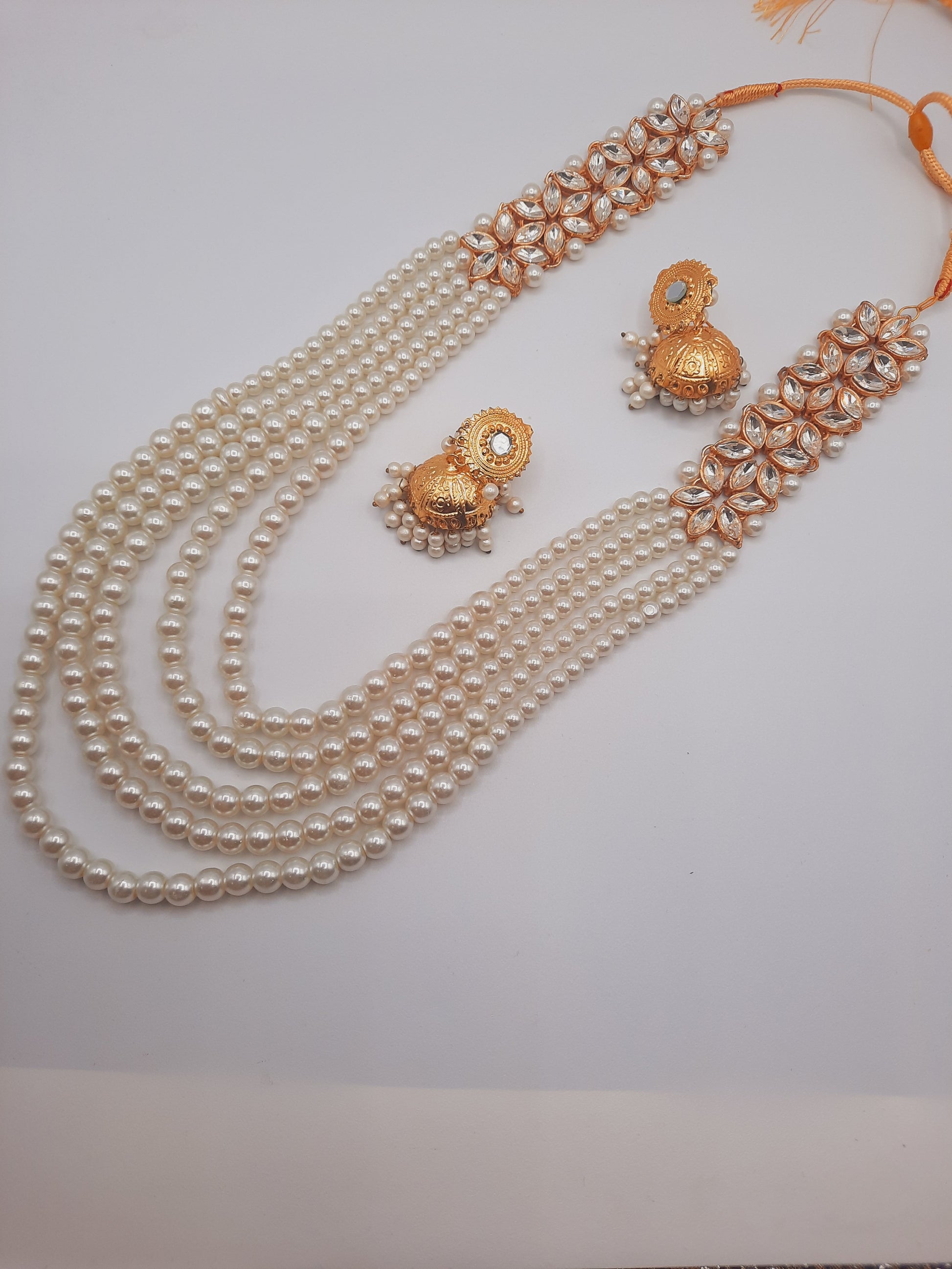 Flower shape gold plated kundan jewelry set with long maala and jhumkas - NATASHAHS