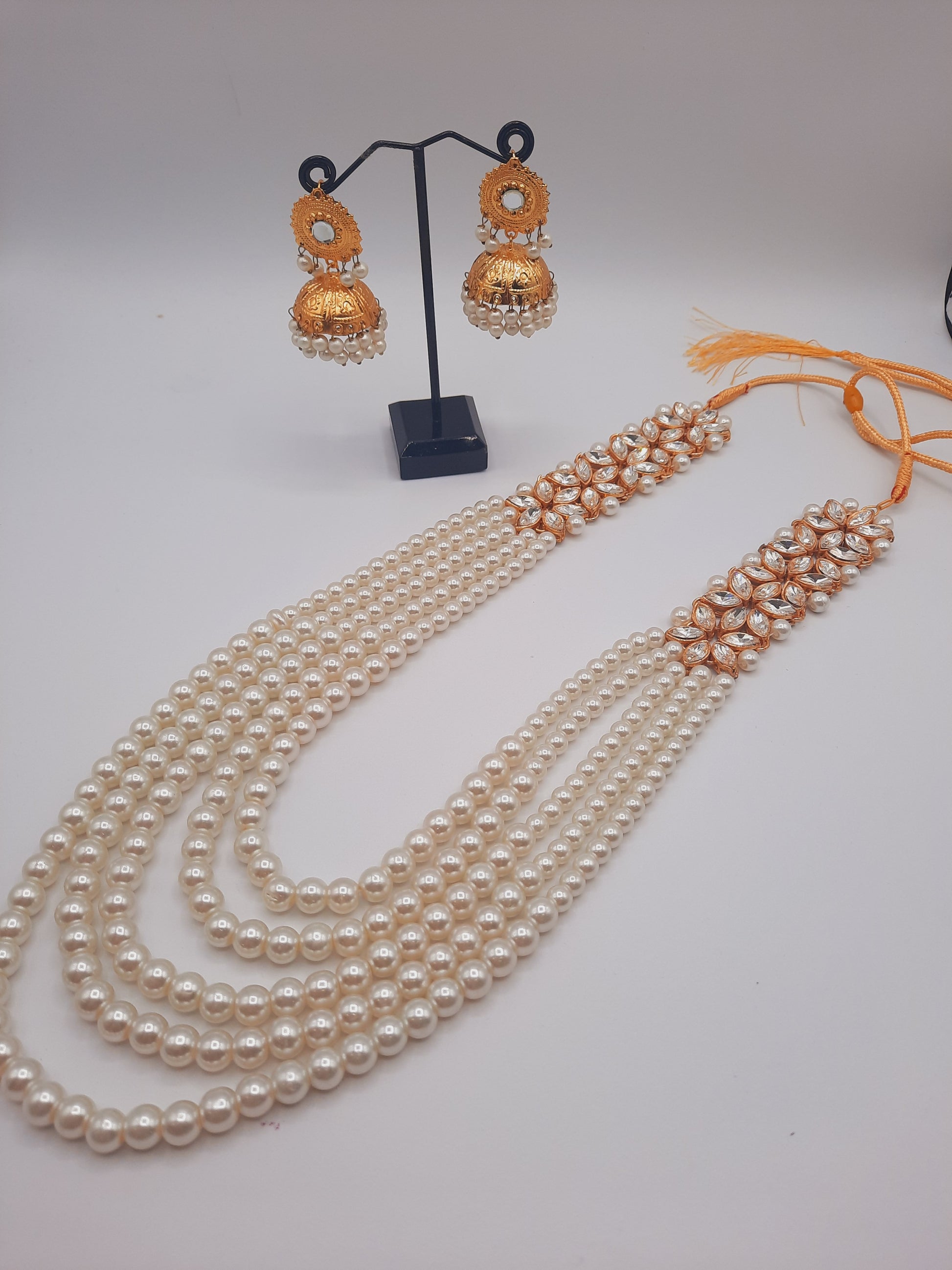 Flower shape gold plated kundan jewelry set with long maala and jhumkas - NATASHAHS