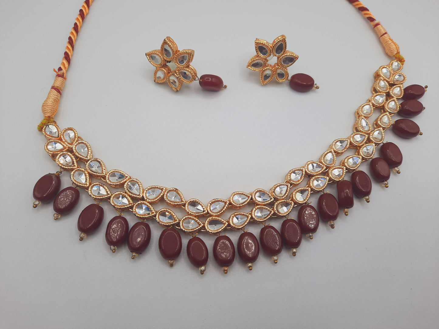 Flower shape gold plated kundan adjustable necklace with earrings in red and green color - NATASHAHS