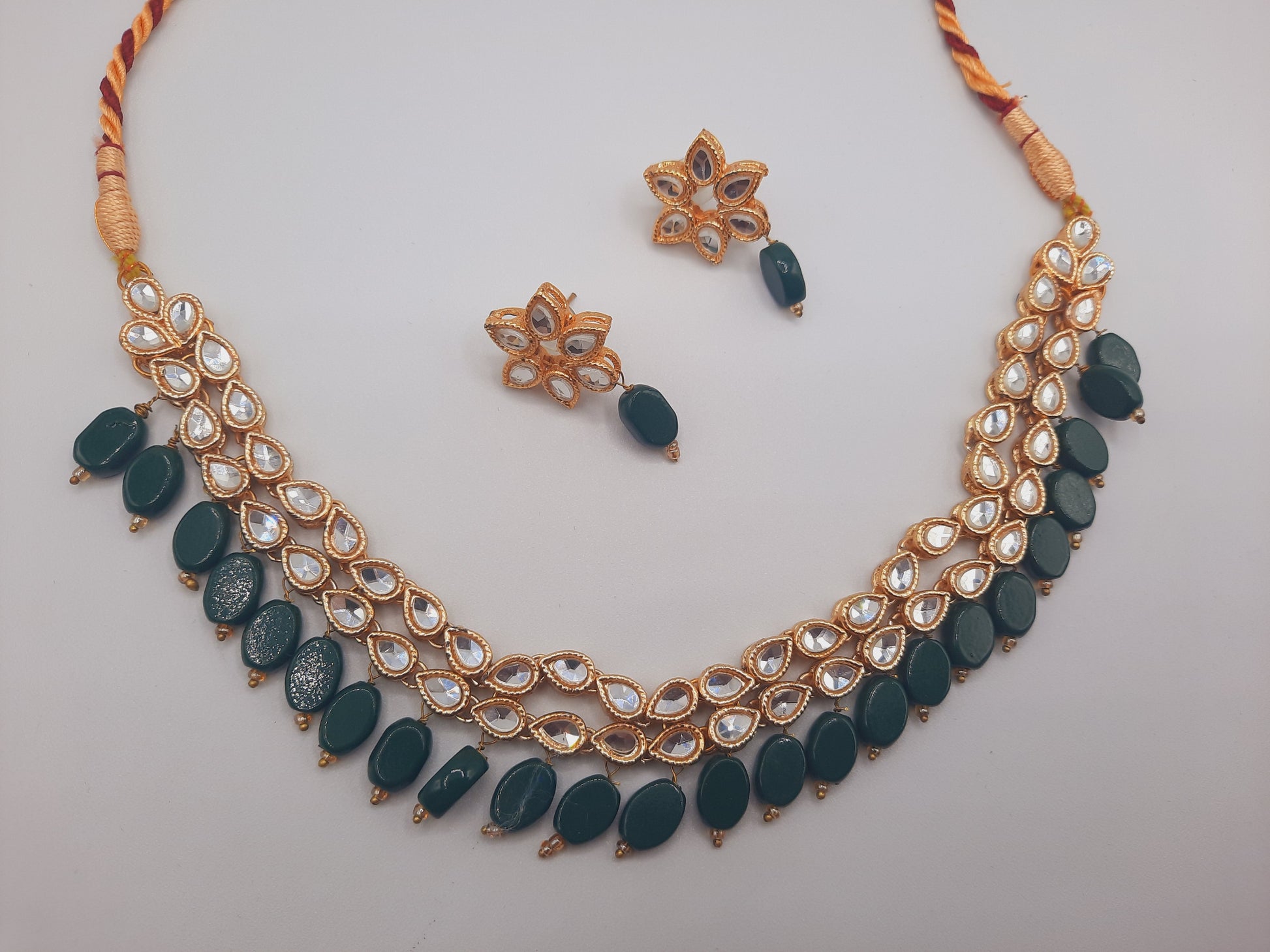 Flower shape gold plated kundan adjustable necklace with earrings in red and green color - NATASHAHS