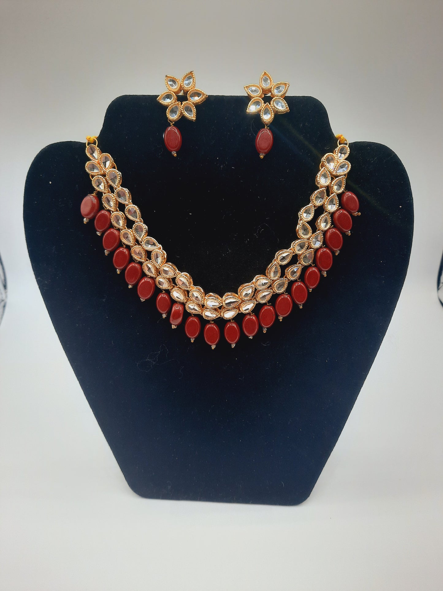 Flower shape gold plated kundan adjustable necklace with earrings in red and green color - NATASHAHS