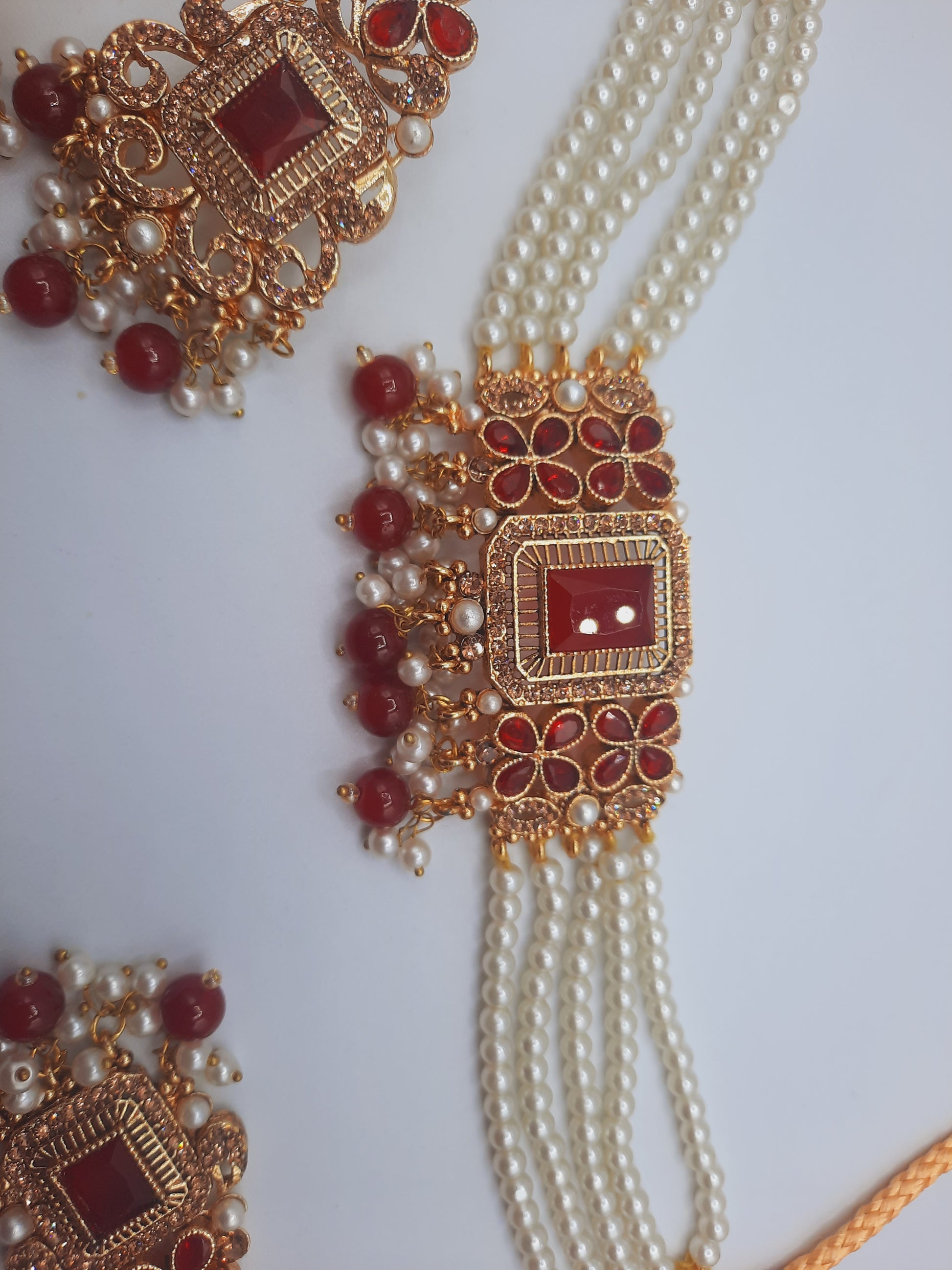 Anarkali choker set with guluband earrings and teeka in red color with gold plated tone - NATASHAHS