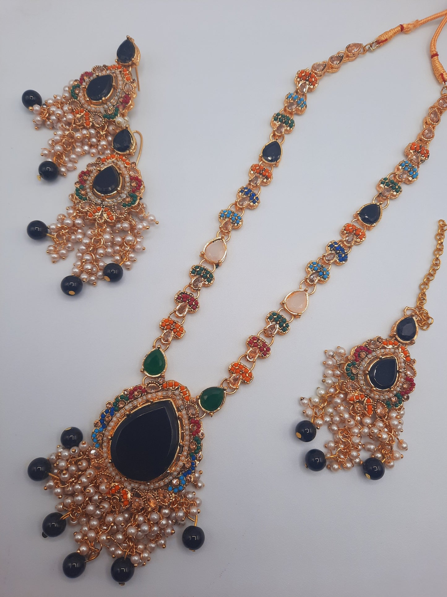Noratan Kundan maala set with earrings and teeka for modern brides in black and green shades - NATASHAHS