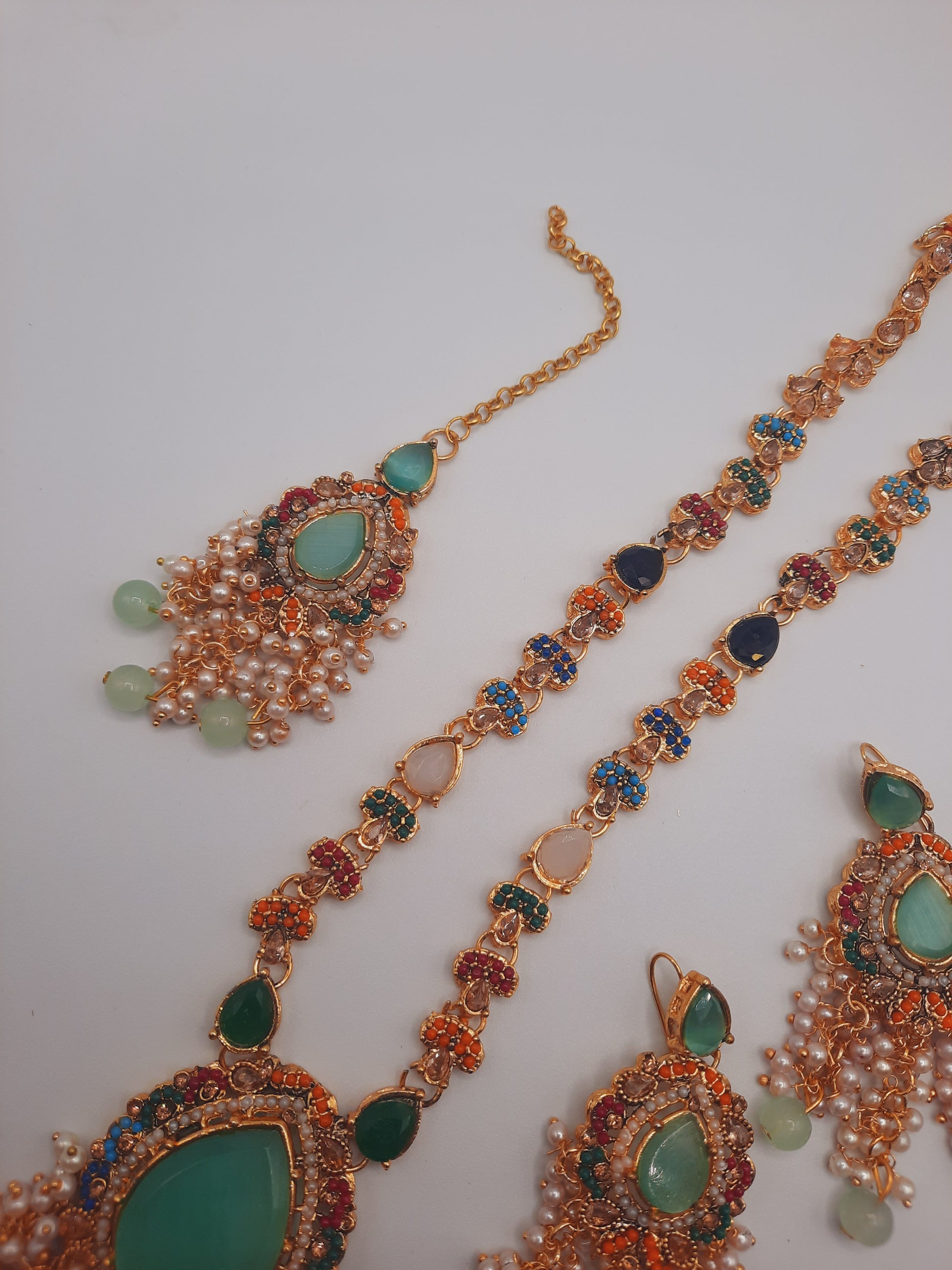 Noratan Kundan maala set with earrings and teeka for modern brides in black and green shades - NATASHAHS