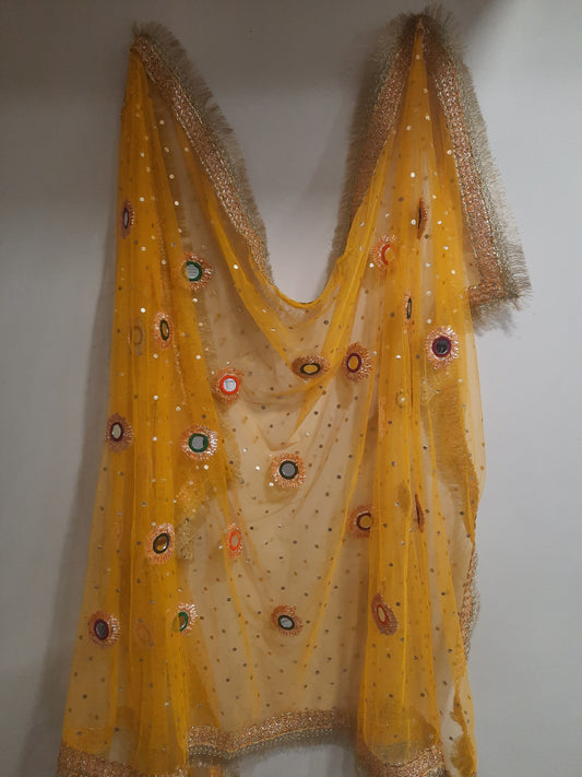 yellow net dupatta with phulkari-style mirror work embroidery