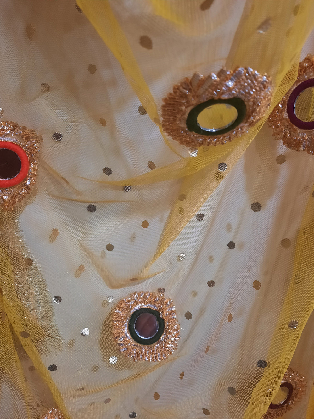 yellow net dupatta with phulkari-style mirror work embroidery