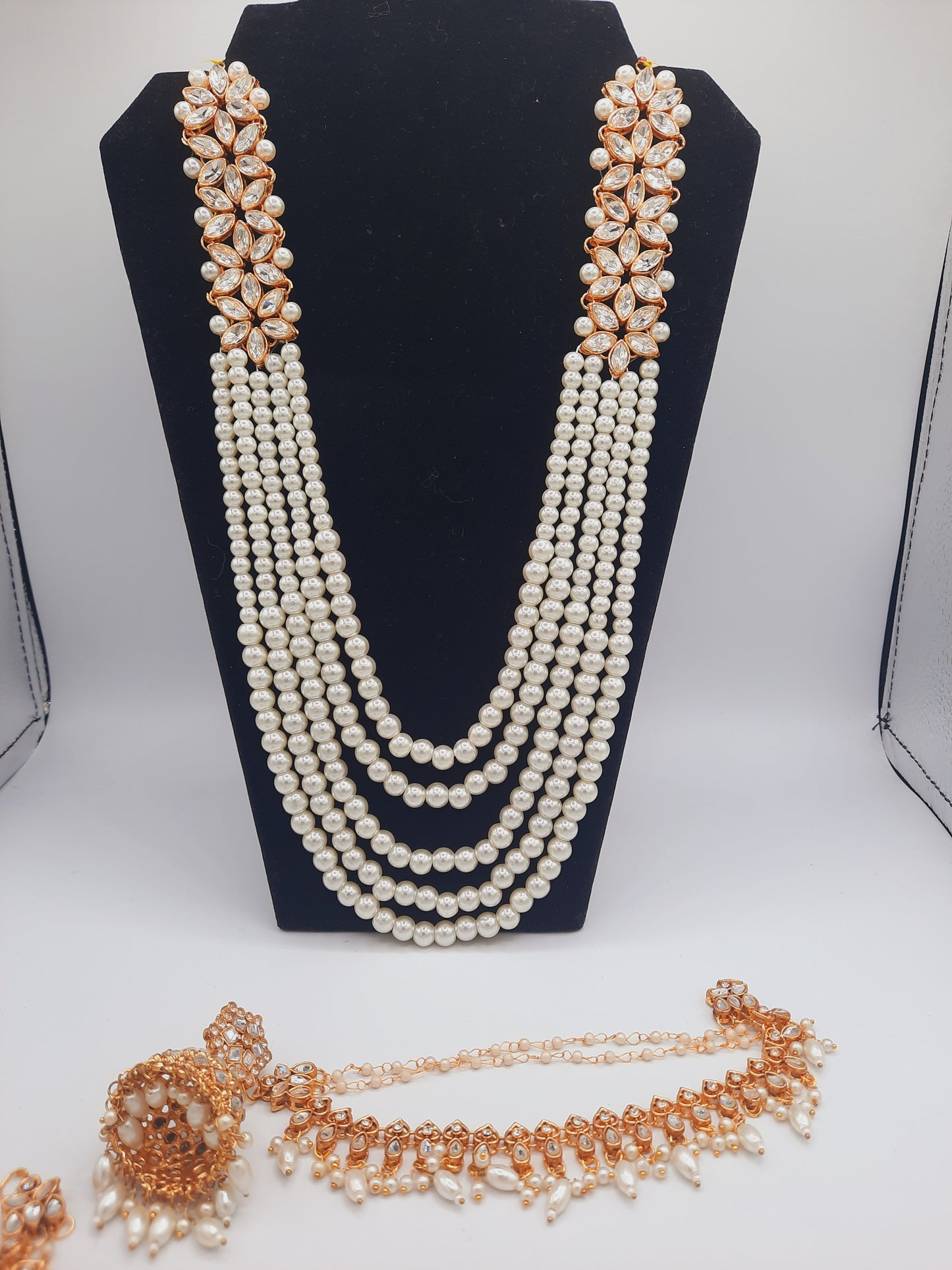 Flower shape gold plated kundan jewelry set with long maala and jhumkas