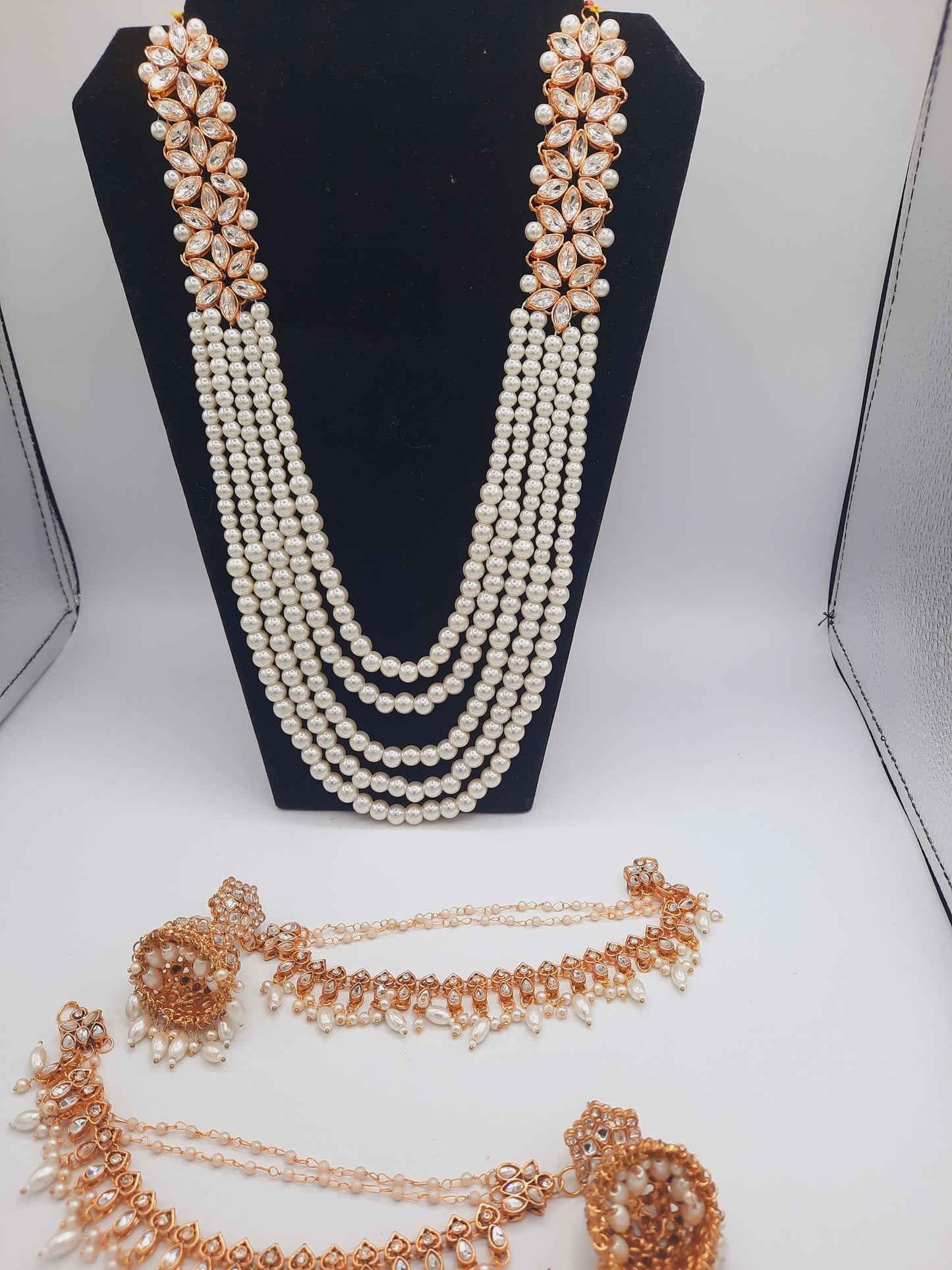 Flower shape gold plated kundan jewelry set with long maala and jhumkas