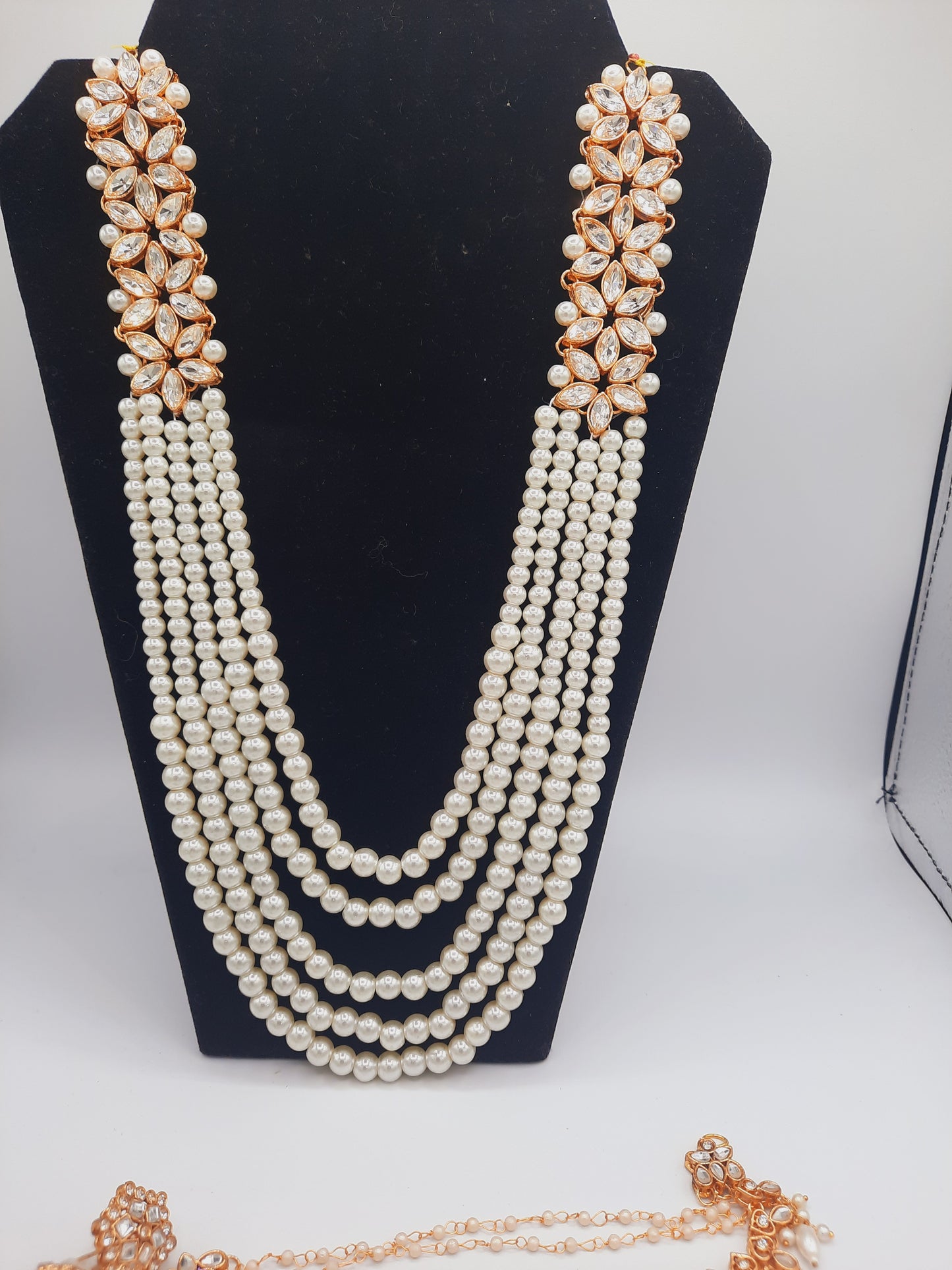 Flower shape gold plated kundan jewelry set with long maala and jhumkas