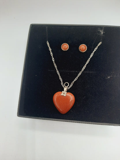 Moonstone pendant and earrings set with silver base