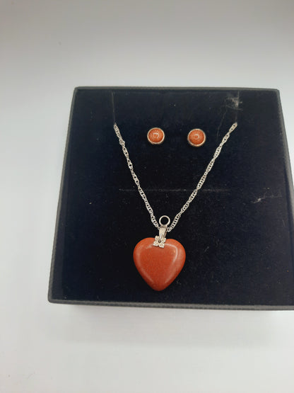 Moonstone pendant and earrings set with silver base