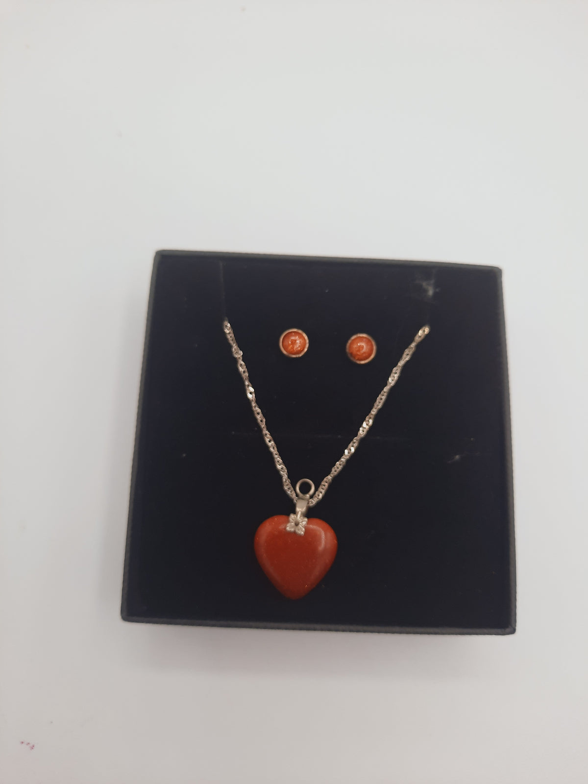 Moonstone pendant and earrings set with silver base