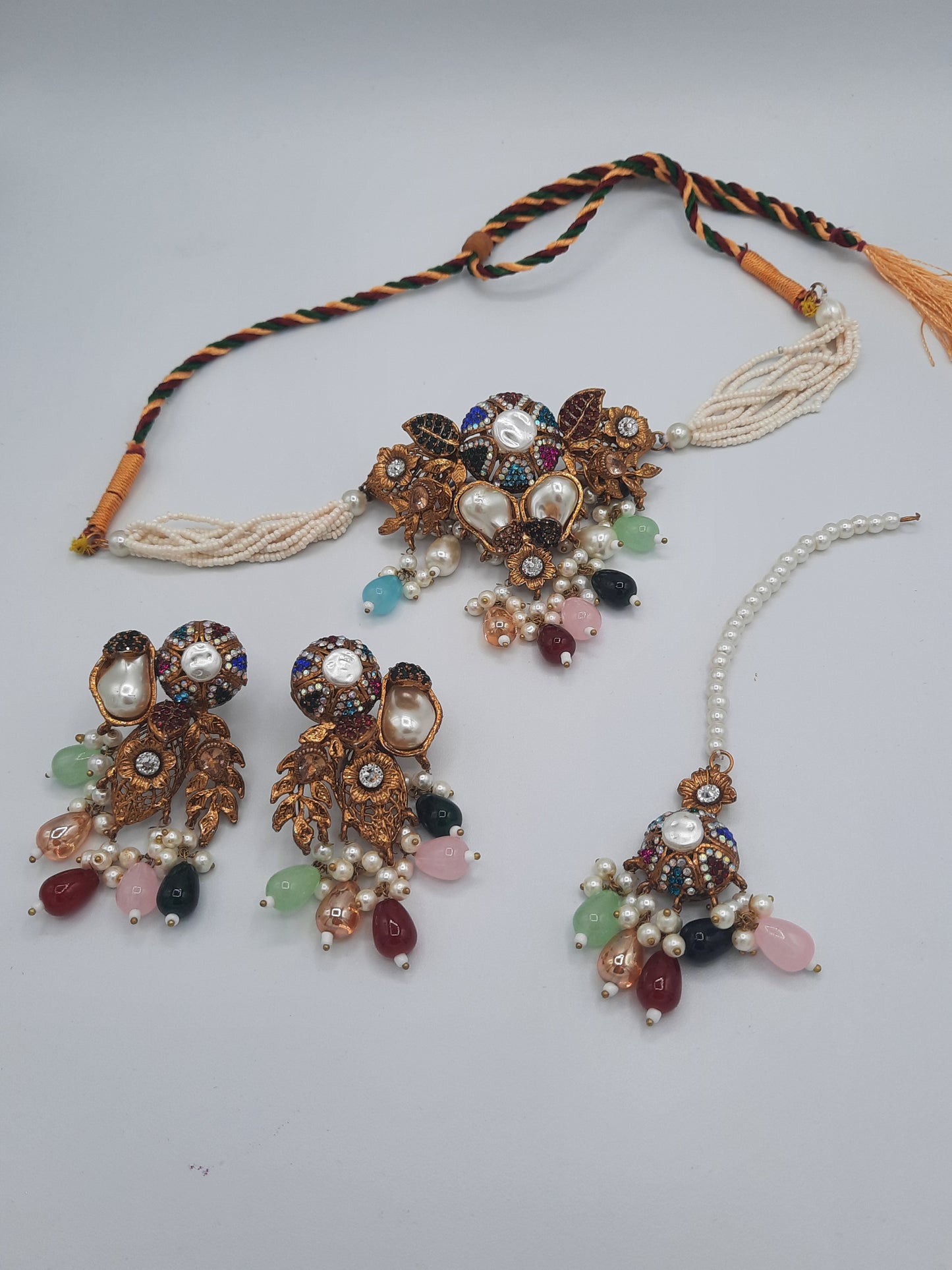 Turkish-style multi-color stone and pearl choker set with matching earrings and a maang tikka.