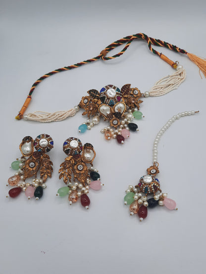 Turkish-style multi-color stone and pearl choker set with matching earrings and a maang tikka.