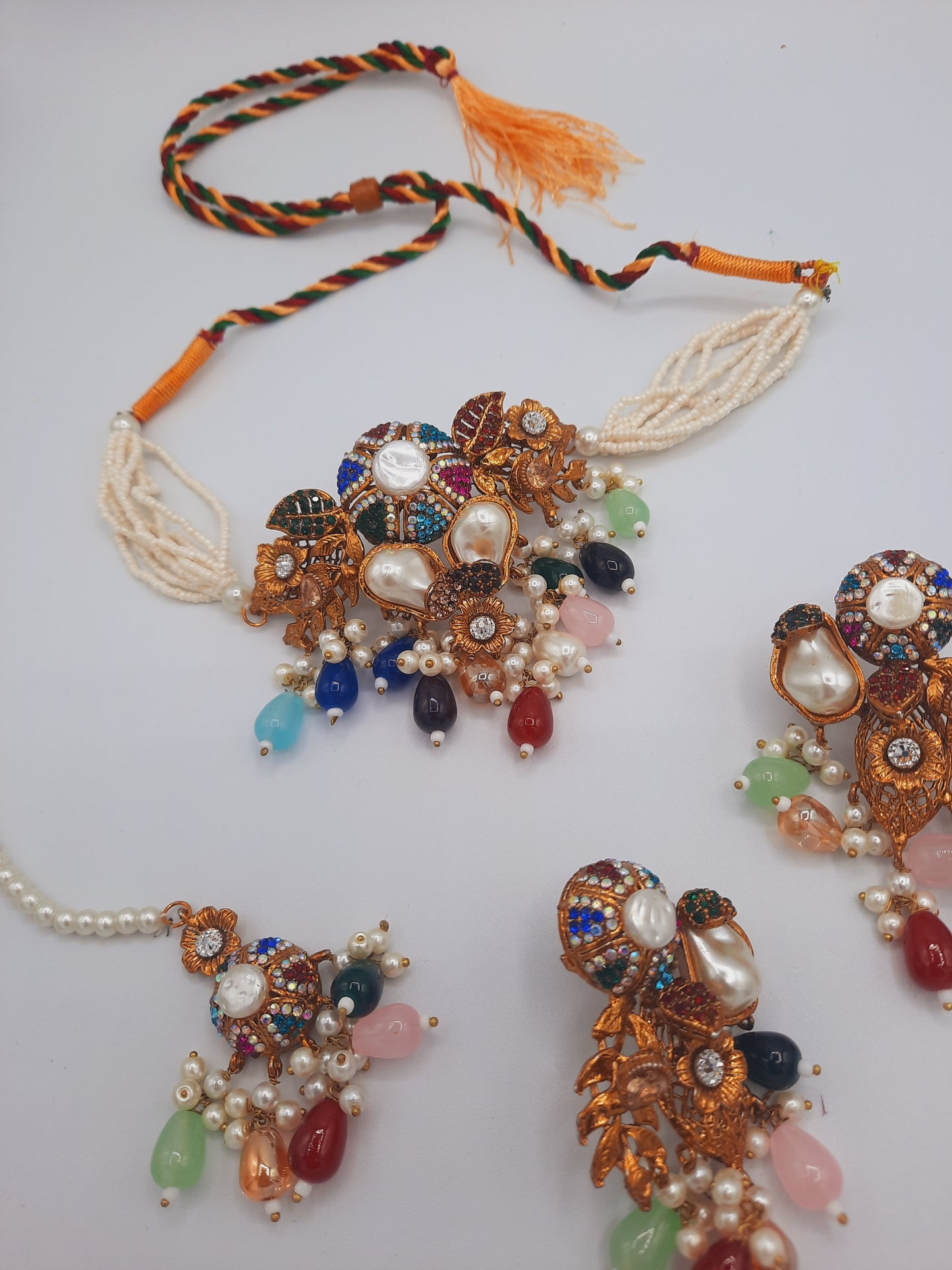Turkish-style multi-color stone and pearl choker set with matching earrings and a maang tikka.