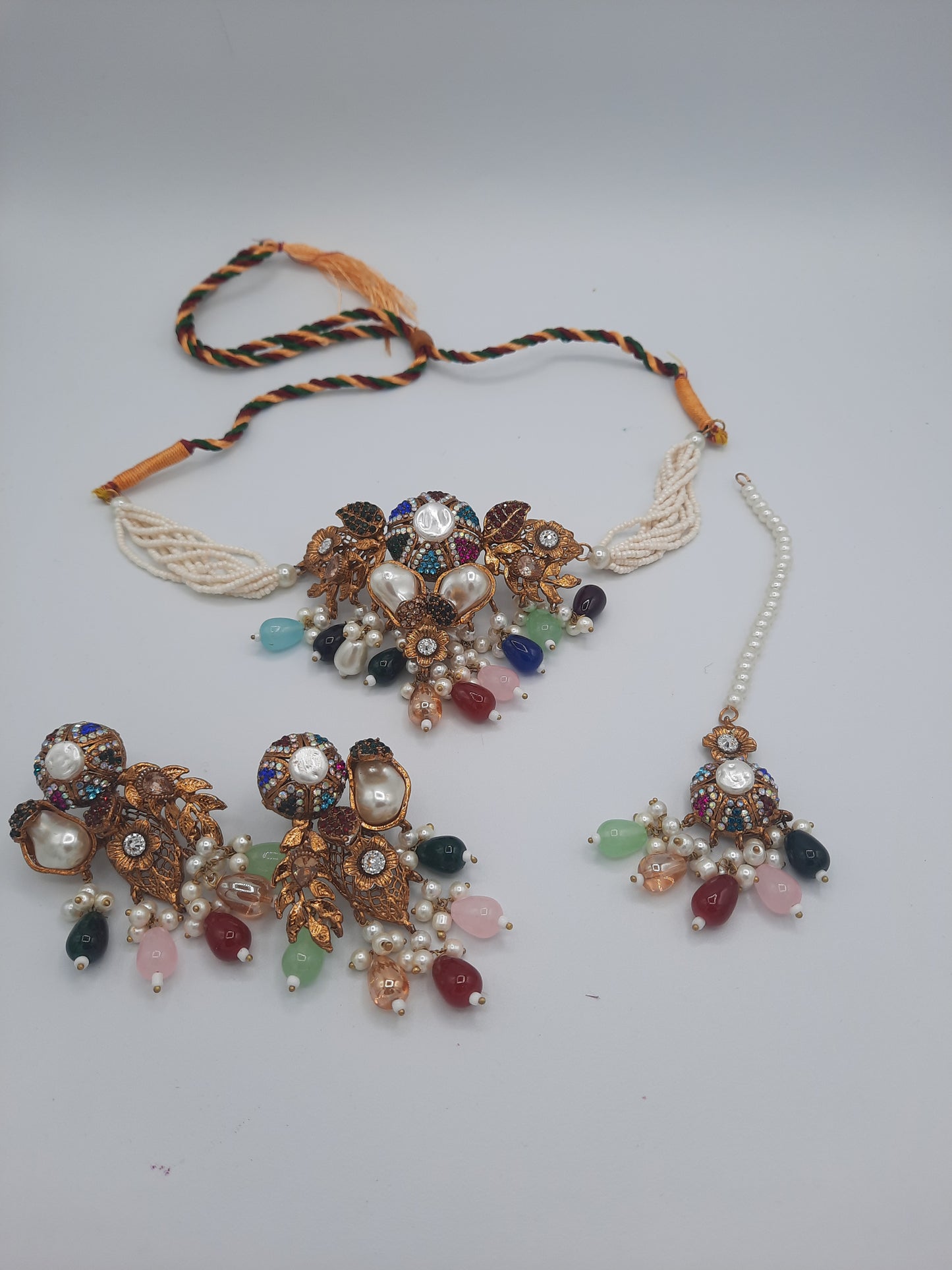 Turkish-style multi-color stone and pearl choker set with matching earrings and a maang tikka.