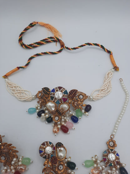 Turkish-style multi-color stone and pearl choker set with matching earrings and a maang tikka.