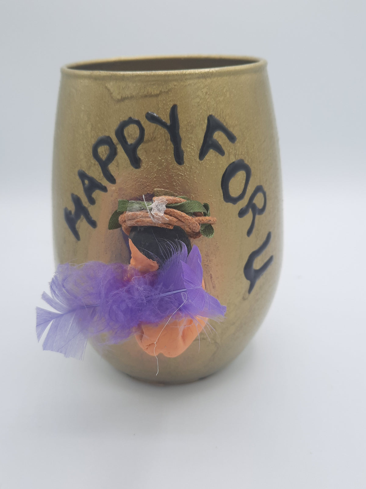Baby miniature on a glass souvenier for mom to be wrapped as a gift