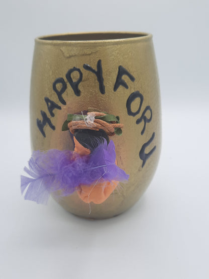 Baby miniature on a glass souvenier for mom to be wrapped as a gift