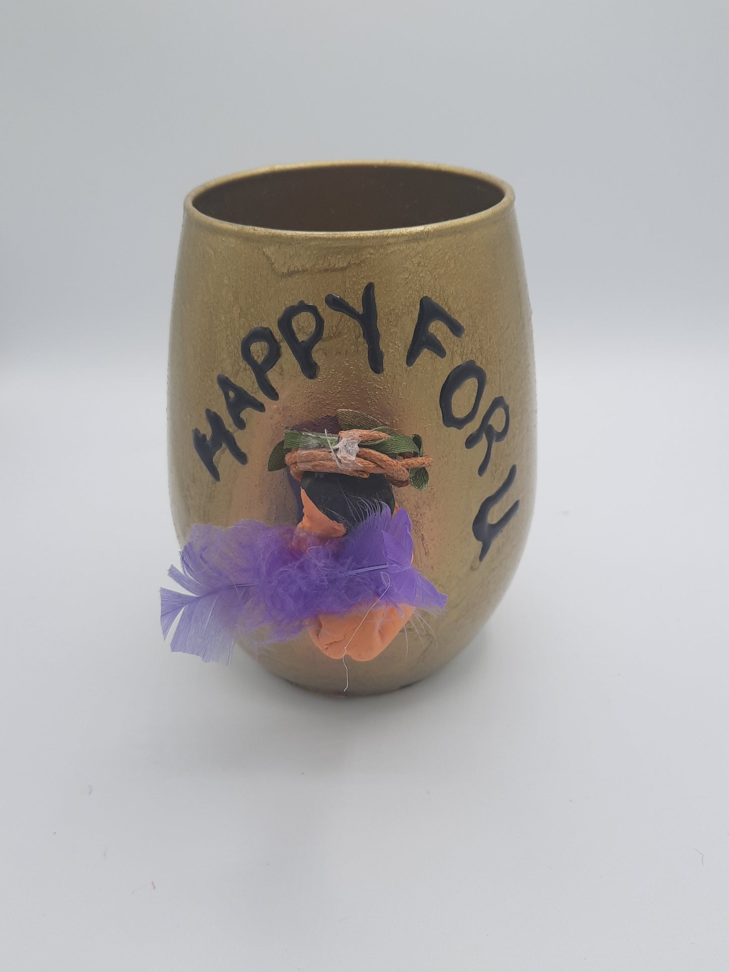 Baby miniature on a glass souvenier for mom to be wrapped as a gift