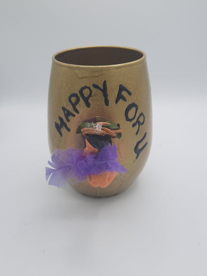 Baby miniature on a glass souvenier for mom to be wrapped as a gift