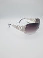 Designer fashion sunglasses with a distinctive decorative design