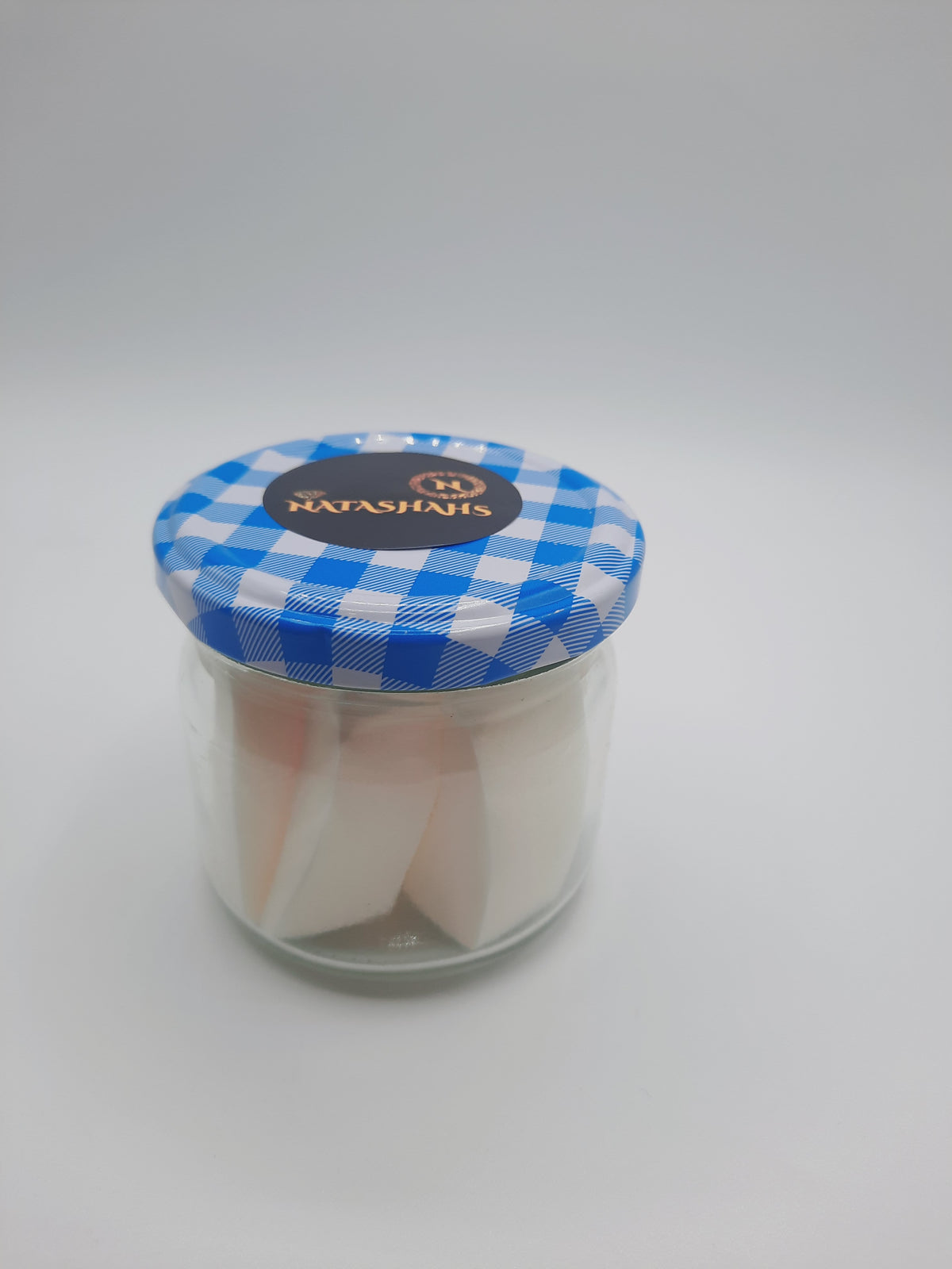 Makeup sponge in glass container approx 10 pieces