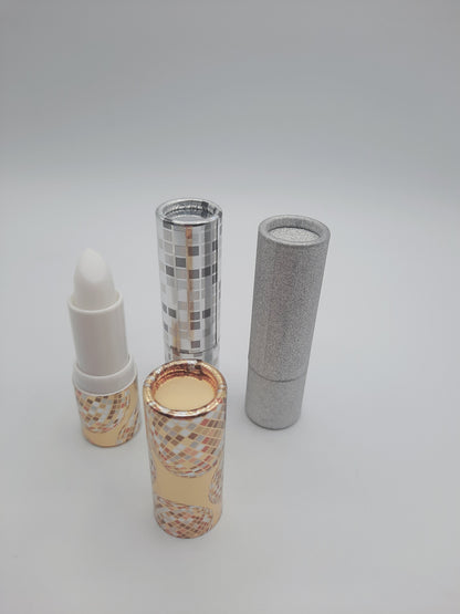 Nicole  Emiller Lip Lift balm treatments alongside their decorative packaging tubes