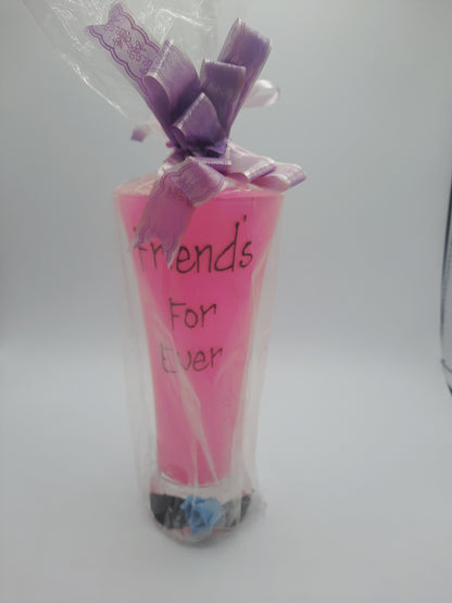 A sentimental, gift-wrapped "Friends For Ever" novelty pink pilsner glass or vase keepsake
