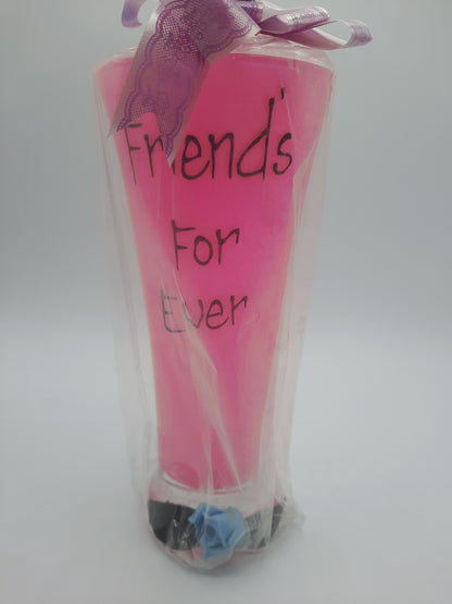 A sentimental, gift-wrapped "Friends For Ever" novelty pink pilsner glass or vase keepsake