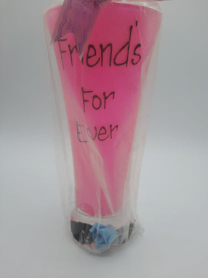 A sentimental, gift-wrapped "Friends For Ever" novelty pink pilsner glass or vase keepsake