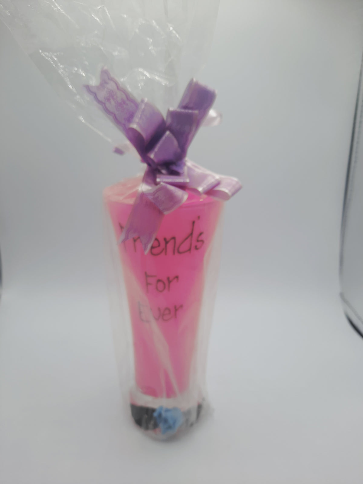 A sentimental, gift-wrapped "Friends For Ever" novelty pink pilsner glass or vase keepsake