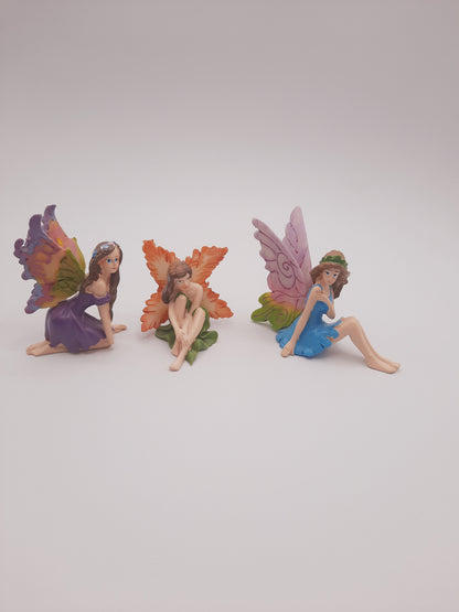 Three miniature fairy figurines styled perfectly for use as whimsical birthday or wedding cake toppers / cake decor
