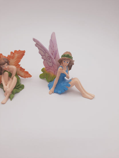 Three miniature fairy figurines styled perfectly for use as whimsical birthday or wedding cake toppers / cake decor