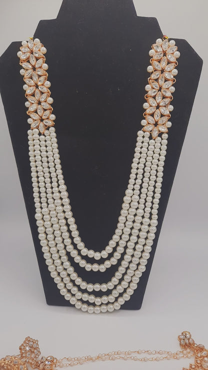 Flower shape gold plated kundan jewelry set with long maala and jhumkas