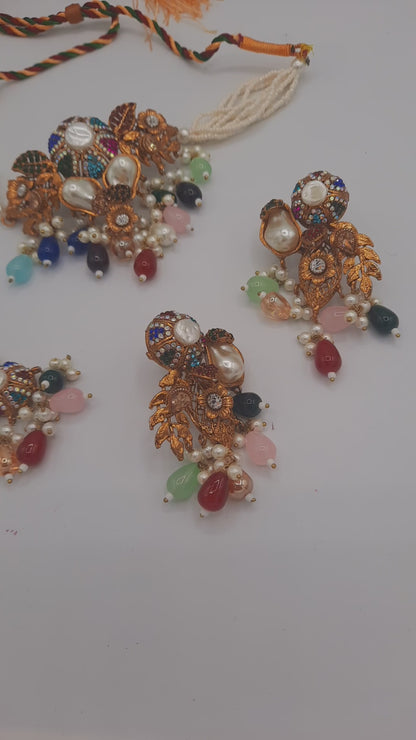 Turkish-style multi-color stone and pearl choker set with matching earrings and a maang tikka.